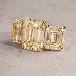 Two Tone Three Stone Emerald Cut Yellow Engagement Ring