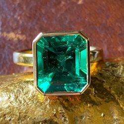 Solitaire Golden Bezel Emerald Cut Emerald Engagement Ring