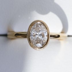 Golden Oval Cut White Sapphire Solitaire Engagement Ring