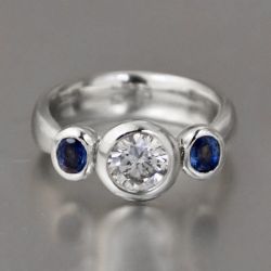 Bezel Round & Oval Cut White & Blue Sapphire Three Stone Engagement Ring