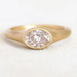 Golden Bezel Solitaire Oval Cut White Sapphire Enagement Ring (1.25 CT. TW.)