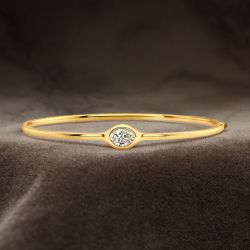 Golden Solitaire Oval Cut White Sapphire Bangle Bracelet (1.25 CT. TW.)