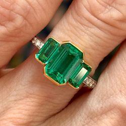 Two Tone Three Stone Emerald Cut Emerald & White Sapphire Engagement Ring