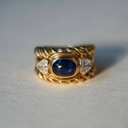 Golden Three Stone Oval Cabochon & Triangle Cut Blue & White Sapphire Engagement Ring