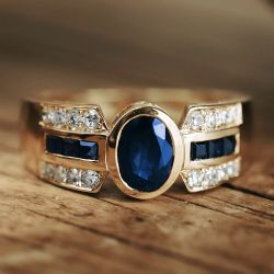 Golden Bezel Oval & Baguette Cut Blue & White Sapphire Engagement Ring