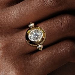 Golden Bezel Oval Cut White Sapphire Engagement Ring