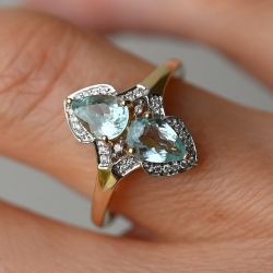 Two Tone Pear & Round Cut Aquamarine & White Sapphire Engagement Ring