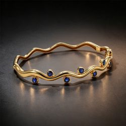 Golden Wave Bezel Round Cut Blue Sapphire Bangle Bracelet