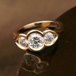 Golden Three Stone Round Cut White Sapphire Engagement Ring