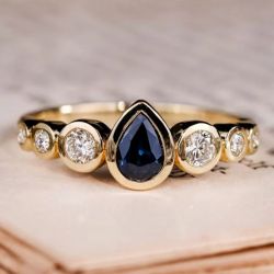 Golden Bezel Pear & Round Cut Blue & White Sapphire Engagement Ring