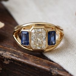 Golden Three Stone Radiant & Emerald Cut White & Blue Sapphire Engagement Ring
