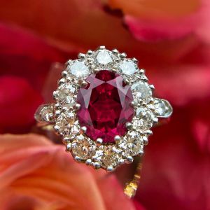 Two Tone Halo Oval Cut Ruby & White Sapphire Engagement Ring