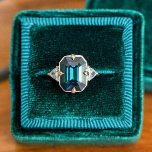 Three Stone Emerald Cut Blue Sapphire Engagement Ring