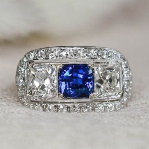 Halo Blue & White Sapphire Radiant Cut Engagement Ring