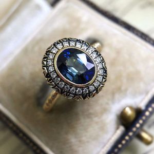 Vintage Golden Halo Blue Sapphire Oval Cut Engagement Ring