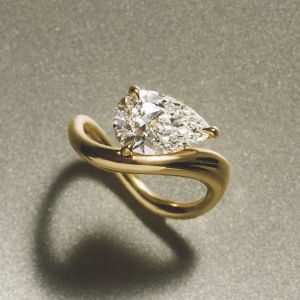 Unique Golden Pear Cut White Sapphire Solitaire Engagement Ring For Women