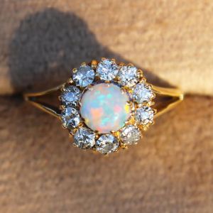 Halo Round Cut White Opal & Sapphire Split Shank Engagement Ring