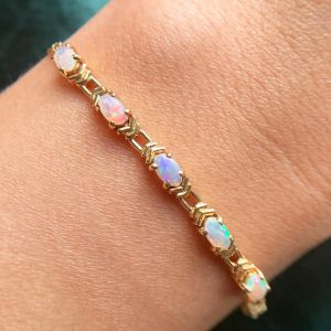 Golden Five Stone Oval Cut White Opal Tennis Bracelet For Women