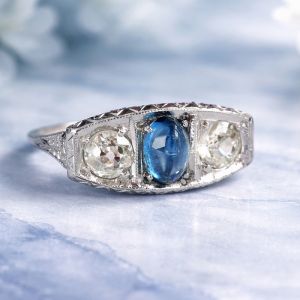 Three Stone Oval Cabochon & Round Cut Blue & White Sapphire Engagement Ring