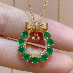 Golden Bow Design Oval & Round Cut Emerald & White Sapphire Pendant Necklace