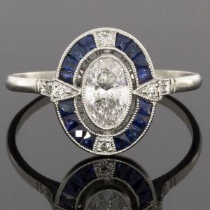 Halo Oval & Baguette Cut White & Blue Sapphire Engagement Ring