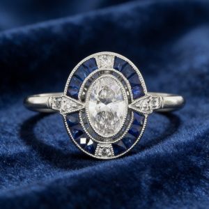 Halo Oval & Baguette Cut White & Blue Sapphire Engagement Ring