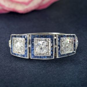 Halo Round & Baguette Cut White & Blue Sapphire Art Deco Engagement Ring
