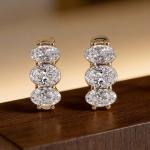 Golden Three Stone Oval Cut White Sapphire Hoop Earrings