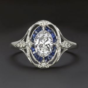 Halo Oval & Baguette Cut White & Blue Sapphire Engagement Ring