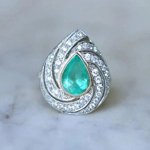 Two Tone Pear & Round Cut Emerald & White Sapphire Engagement Ring