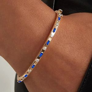 Golden Alternating Baguette & Round Cut Blue & White Sapphire Bangle Bracelet