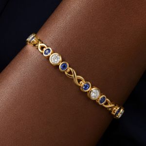 Golden Bezel Round & Oval Cut White & Blue Sapphire Tennis Bracelet