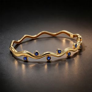 Golden Wave Bezel Round Cut Blue Sapphire Bangle Bracelet