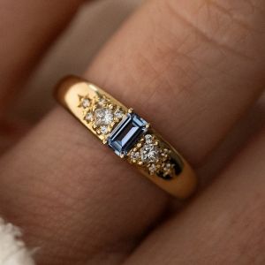 Golden Emerald & Princess & Round Cut Blue Topaz & White Sapphire Engagement Ring