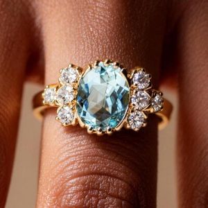 Golden Oval & Round Cut Aquamarine & White Sapphire Engagement Ring