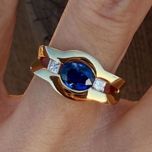 Golden Three Stone Oval & Princess Cut Blue & White Sapphire Engagement Ring