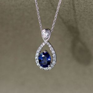 Halo Oval & Round Cut Blue & White Sapphire Infinity Pendant Necklace