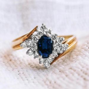 Two Tone Oval & Round Cut Blue & White Sapphire Engagement Ring