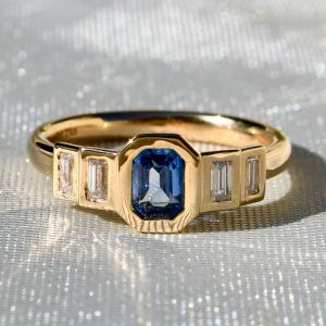 Golden Bezel Emerald & Baguette Cut Blue & White Sapphire Engagement Ring