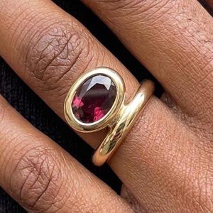 Golden Bezel Solitaire Oval Cut Garnet Sapphire Engagement Ring